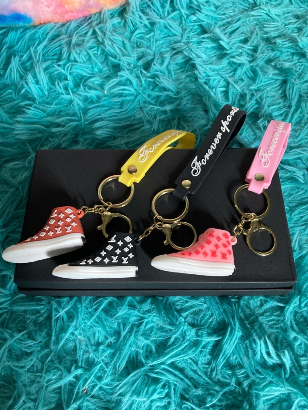 3 Sneaker Keychain Charms with Colorful Straps sold separately.